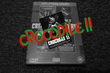 Black and white image of DVD case, with the words Crocodile 2 superimposed in red and green